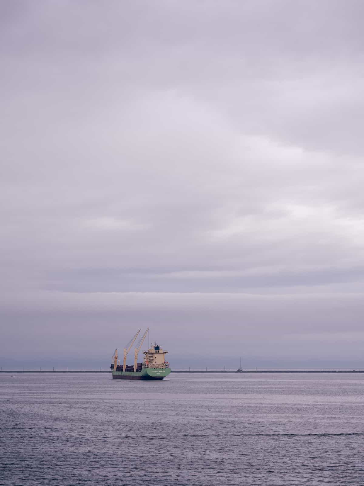 A cargo ship floating on water