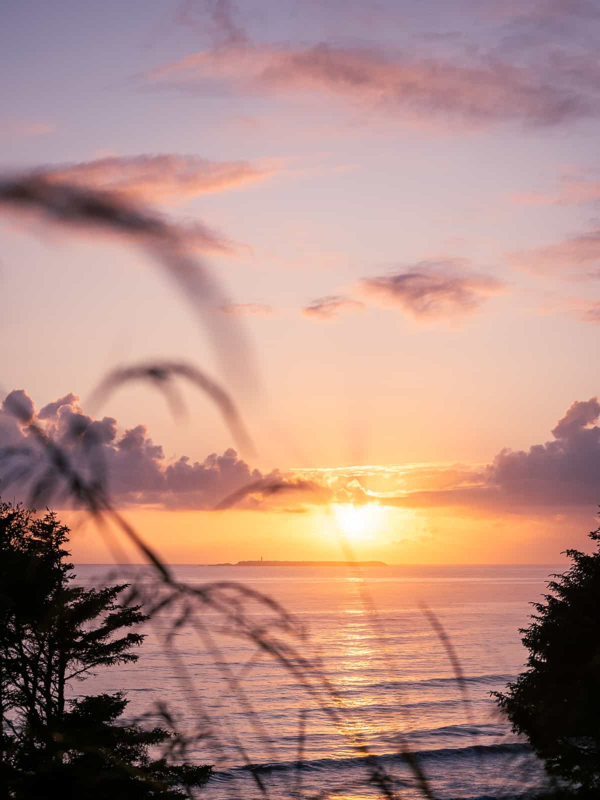 Sunset with a lighthouse in the distance