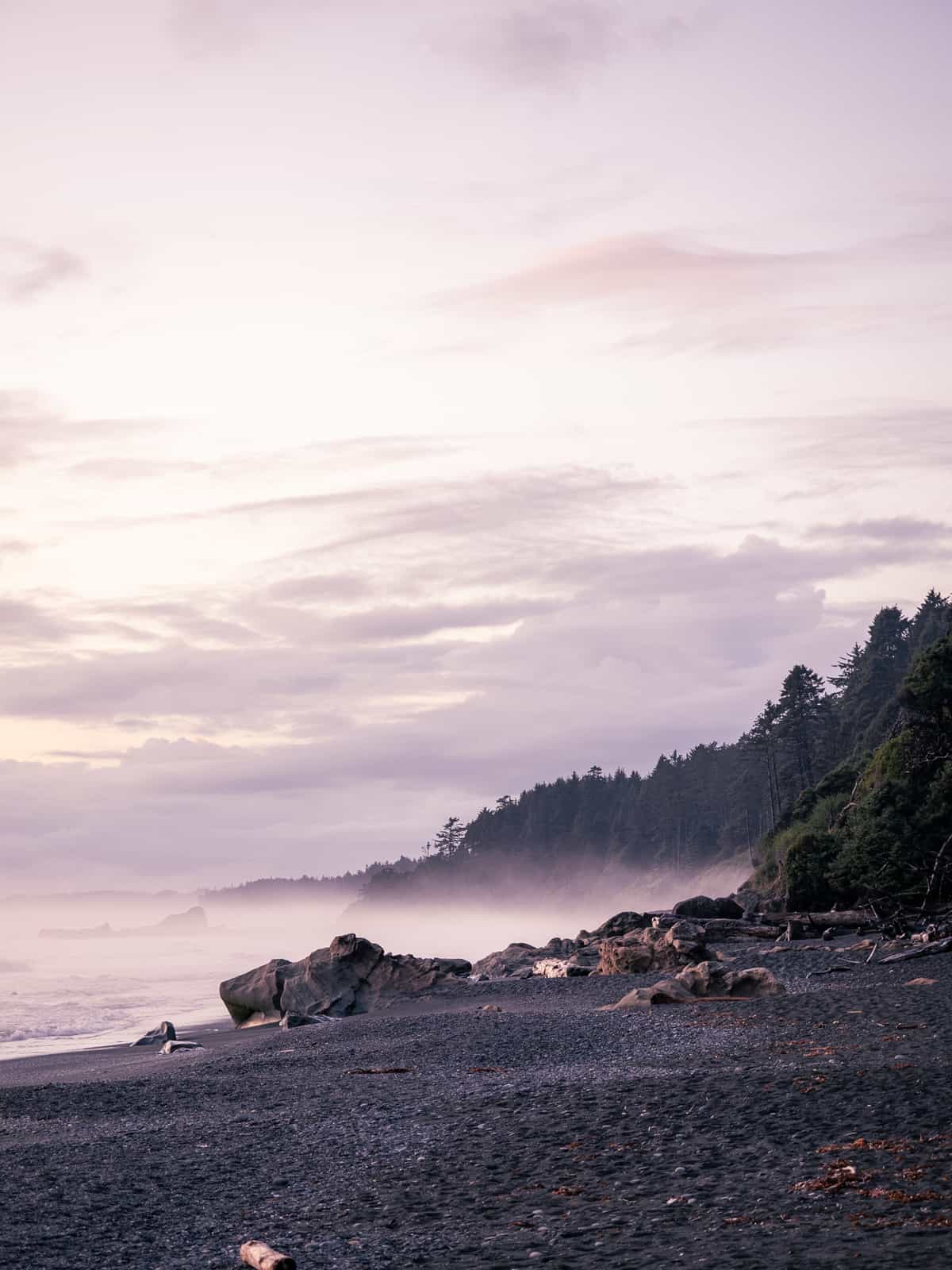 A coastal ridge line with hazy coming off of the ocean