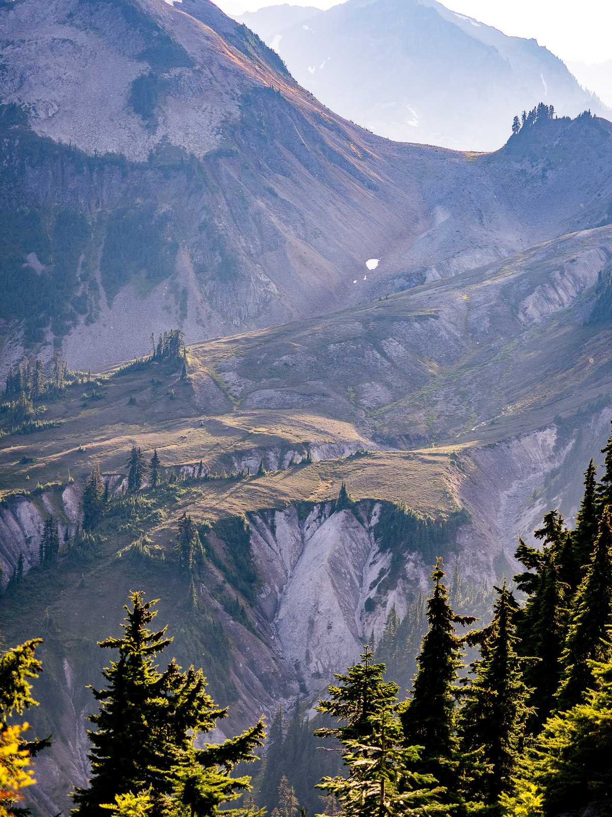 Distant plateaus with a hazy ridge behind them.