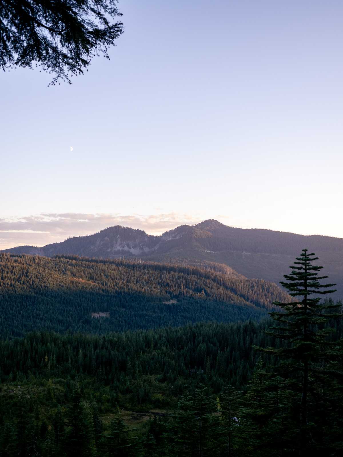 Mountain ridges in the distance catch the last of sunset light