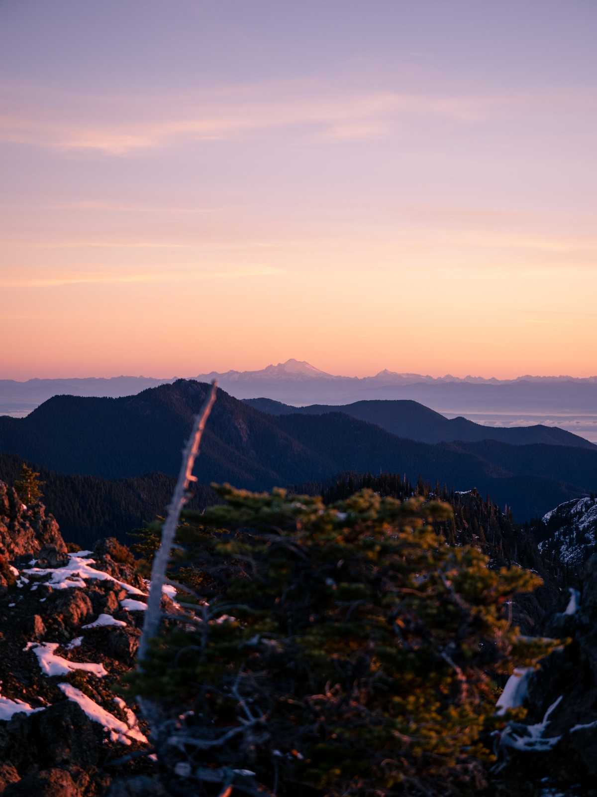 Mountain Baker and other mountains are physical in the far distance in a hazy sunrise sky